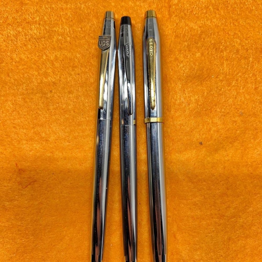 Three different Cross pens branded